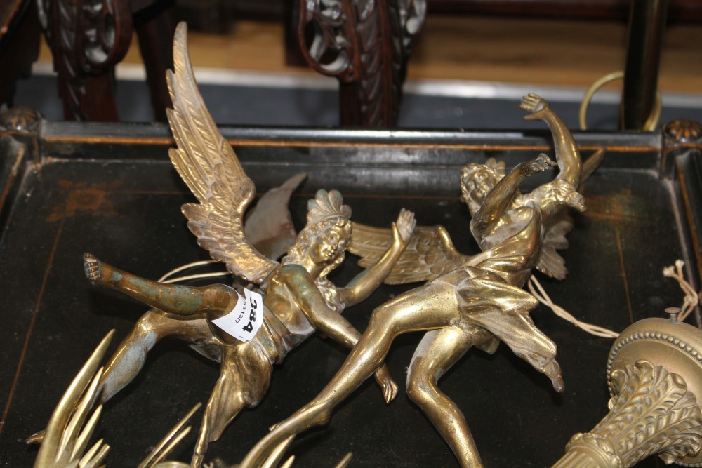 A pair of gilt bronze angel hanging light fittings, height 39cm, a torch wall light, 26cm and a pair of brass dragon chambersticks, 16c